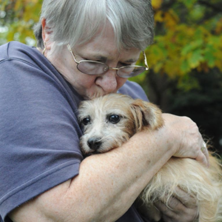 Woman holding dog